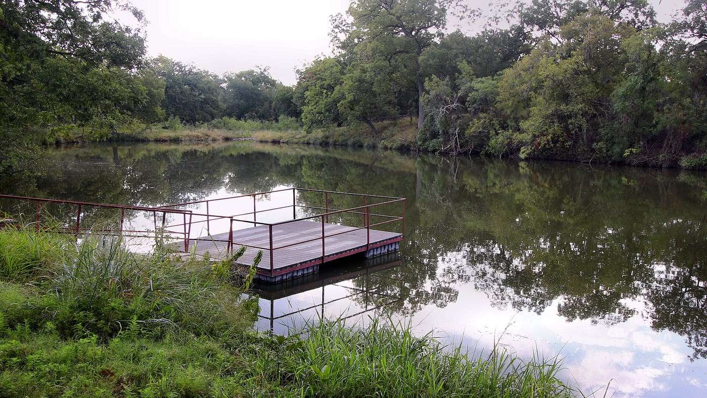 A fishing pier in Buck Lake in South Llano River State Park near Junction, Texas, United States.