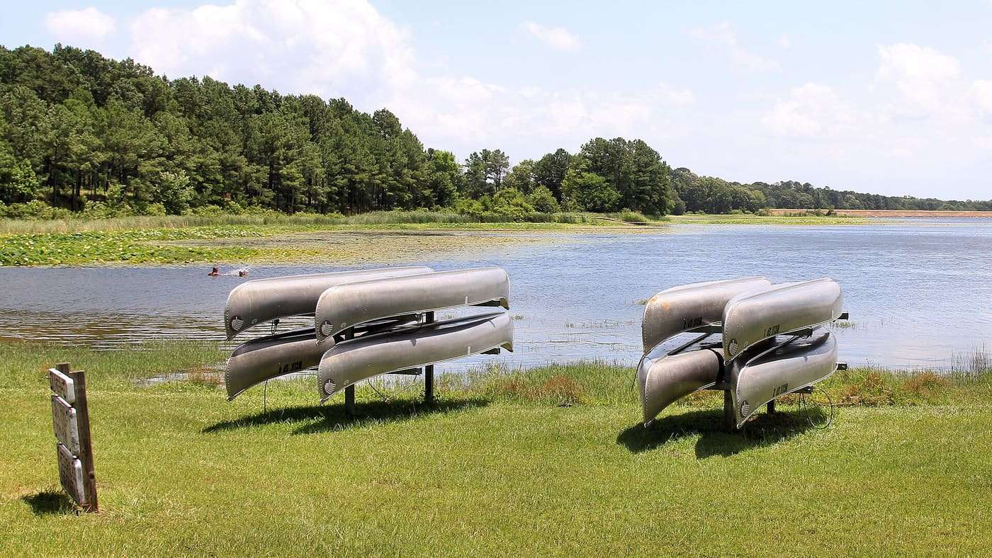 Rental canoes stacked at Martin Creek Lake State Park in Rusk County, Texas, United States.