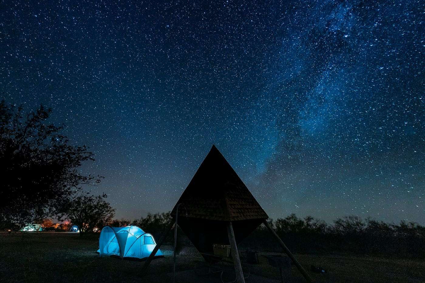 Stargazing at Copper Breaks State Park in Hardeman County, Texas, United States with the Milky Way Galaxy and glowing tent
