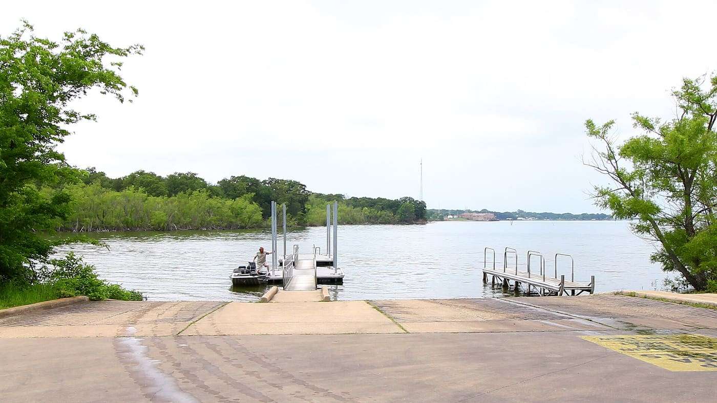 A boater pushes off from the dock at Lake Tawakoni State Park in Hunt County, Texas, Unted States.